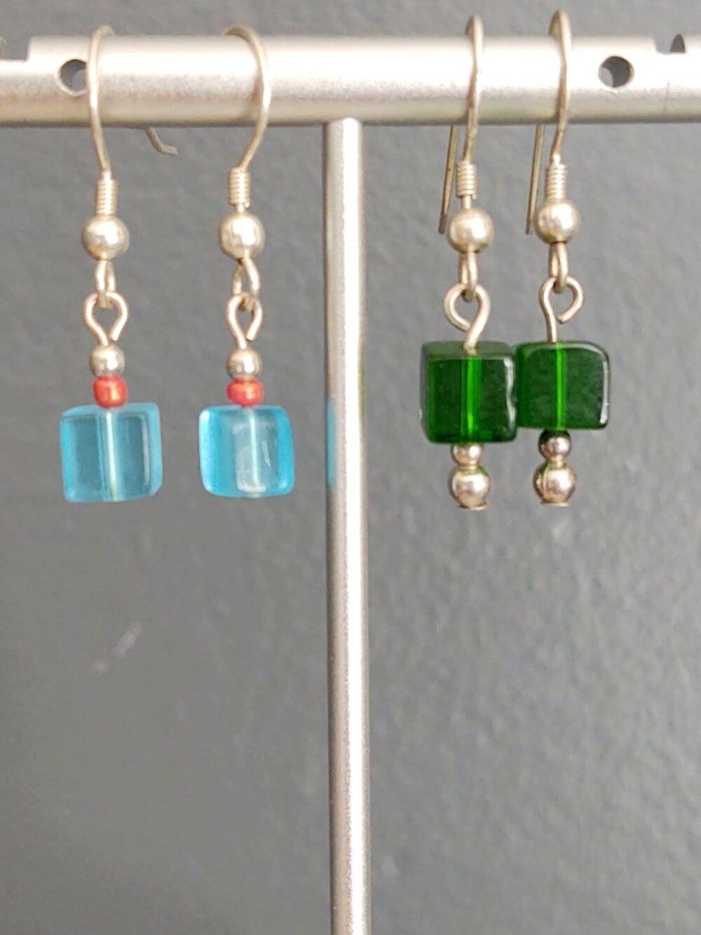 2 pairs of glass cube earrings in blue and green